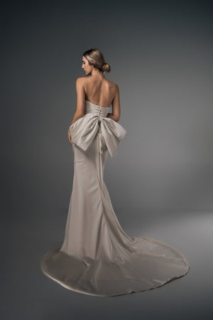 Nerina ruched satin mermaid wedding dress, bow-back train view