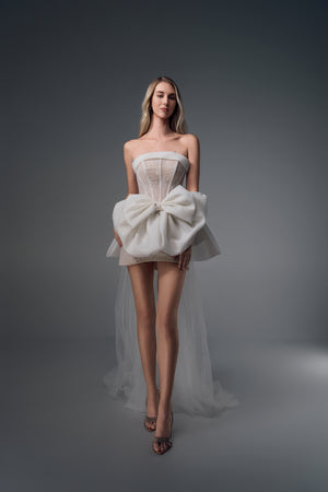 Novella sheer-bodice mini wedding dress with bow train, front view