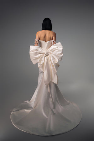 Sidonie wedding dress with oversized sculptural satin bow, back view