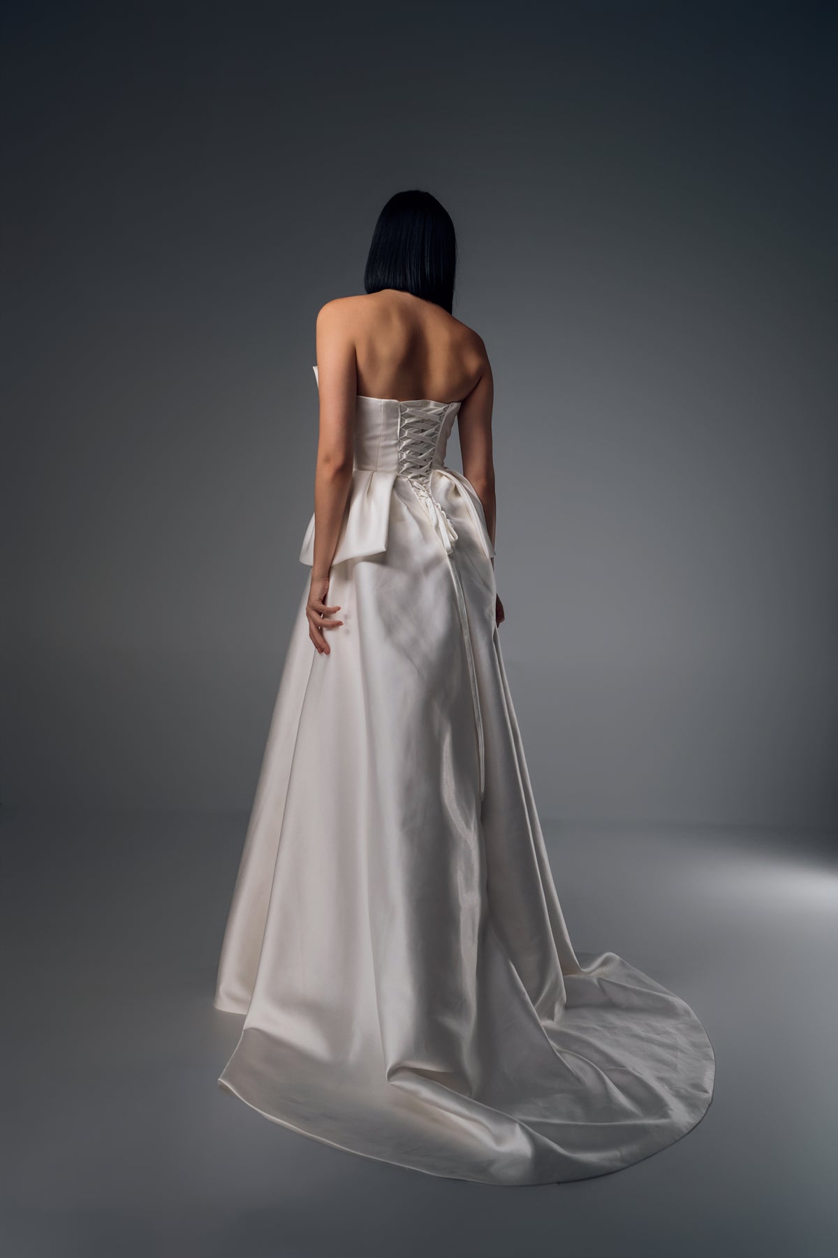 Adalina strapless structured satin A-line wedding dress, back train view