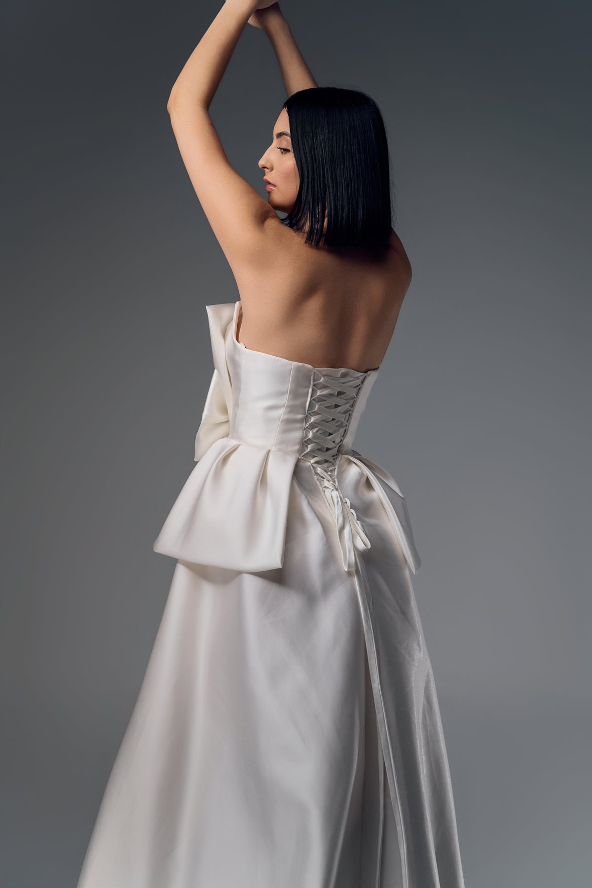 Adalina strapless structured satin A-line wedding dress, back view