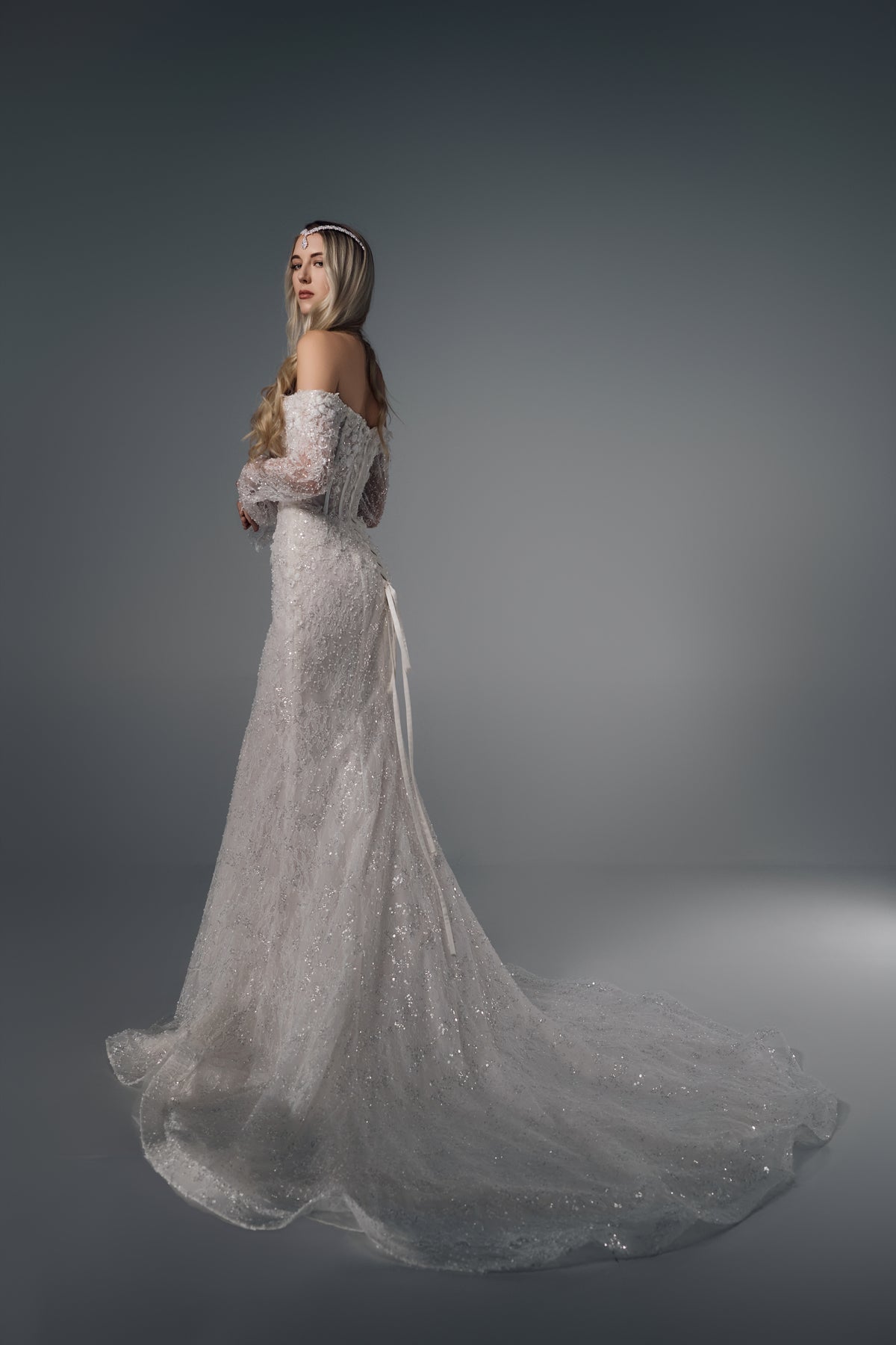 Asteria off-shoulder floral lace mermaid wedding dress, side train view