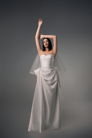 Cyrene minimal satin column wedding dress with sculptural bow back, front view