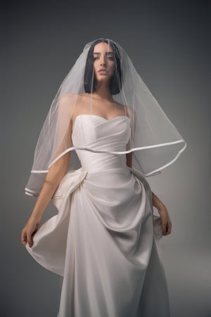 Cyrene minimal satin column wedding dress with sculptural bow back, veil view