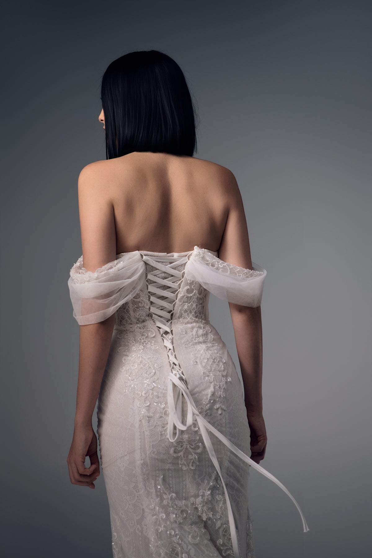 Eulalie low lace-up back and draped sleeves, back view