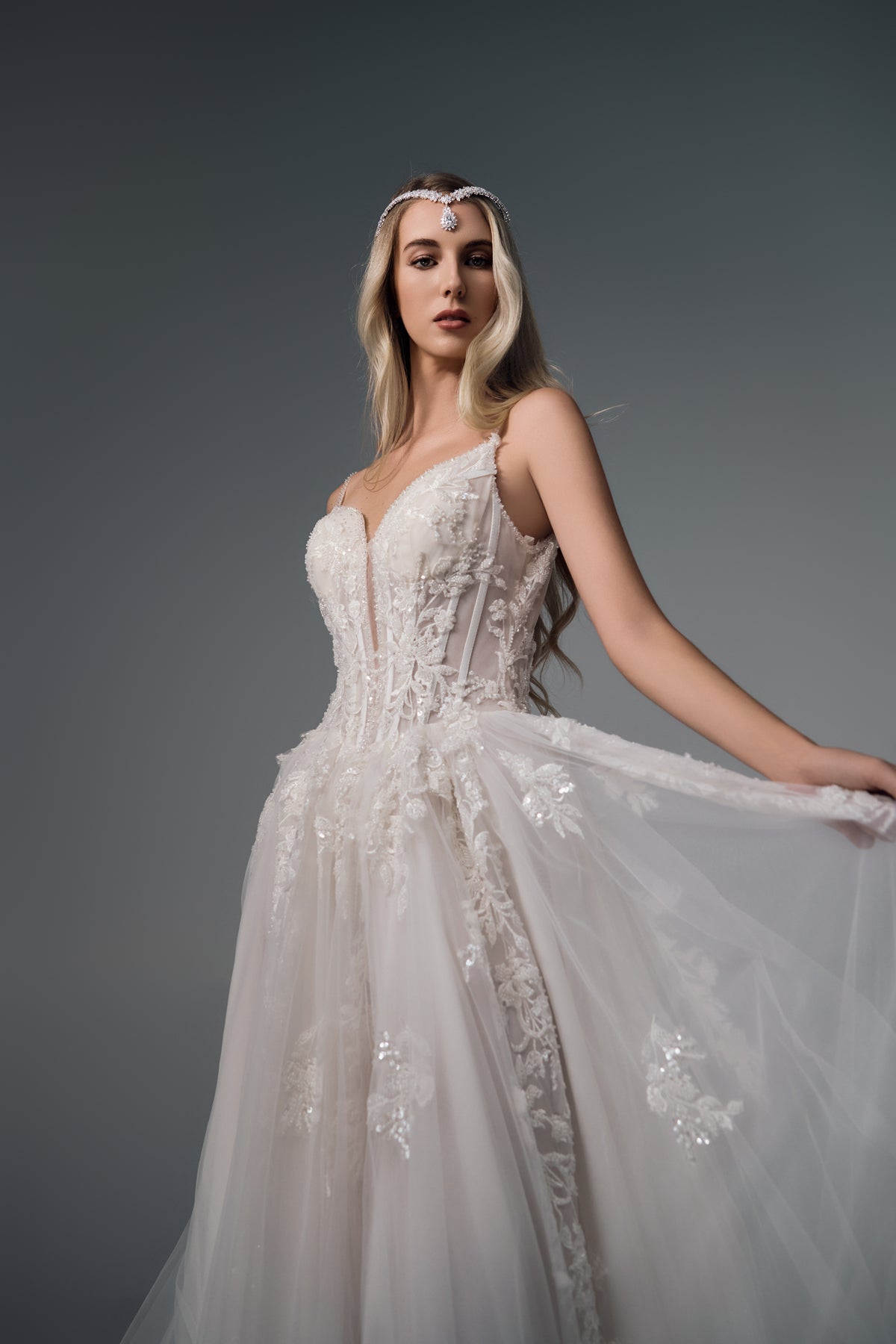 Evania spaghetti-strap lace A-line wedding dress, side view