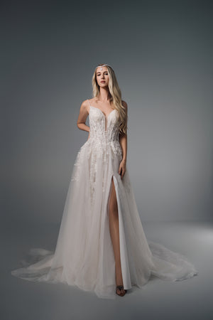 Evania spaghetti-strap lace A-line wedding dress with split, full-length front view