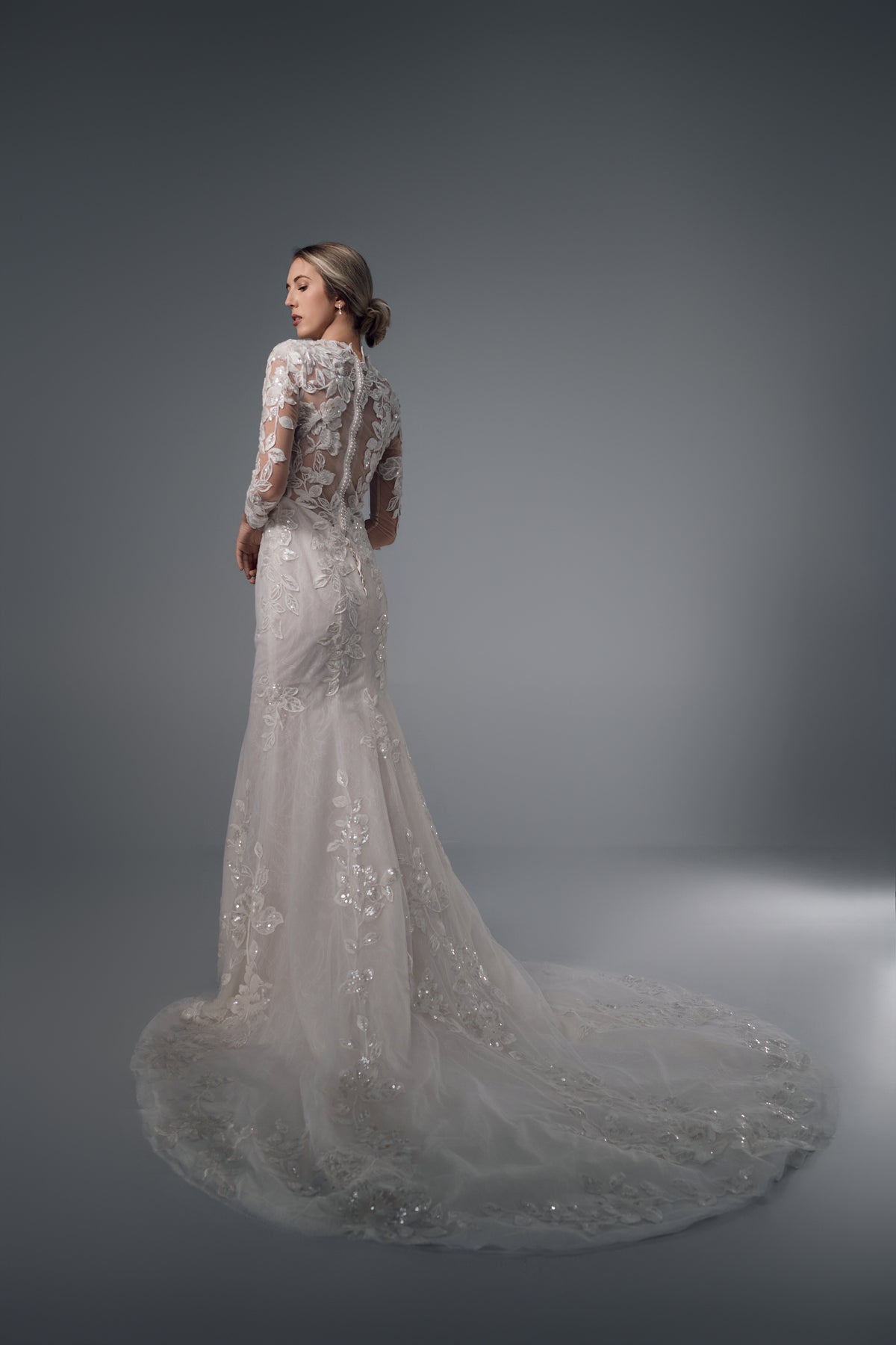 Galatea long-sleeve floral lace mermaid wedding dress, side train view