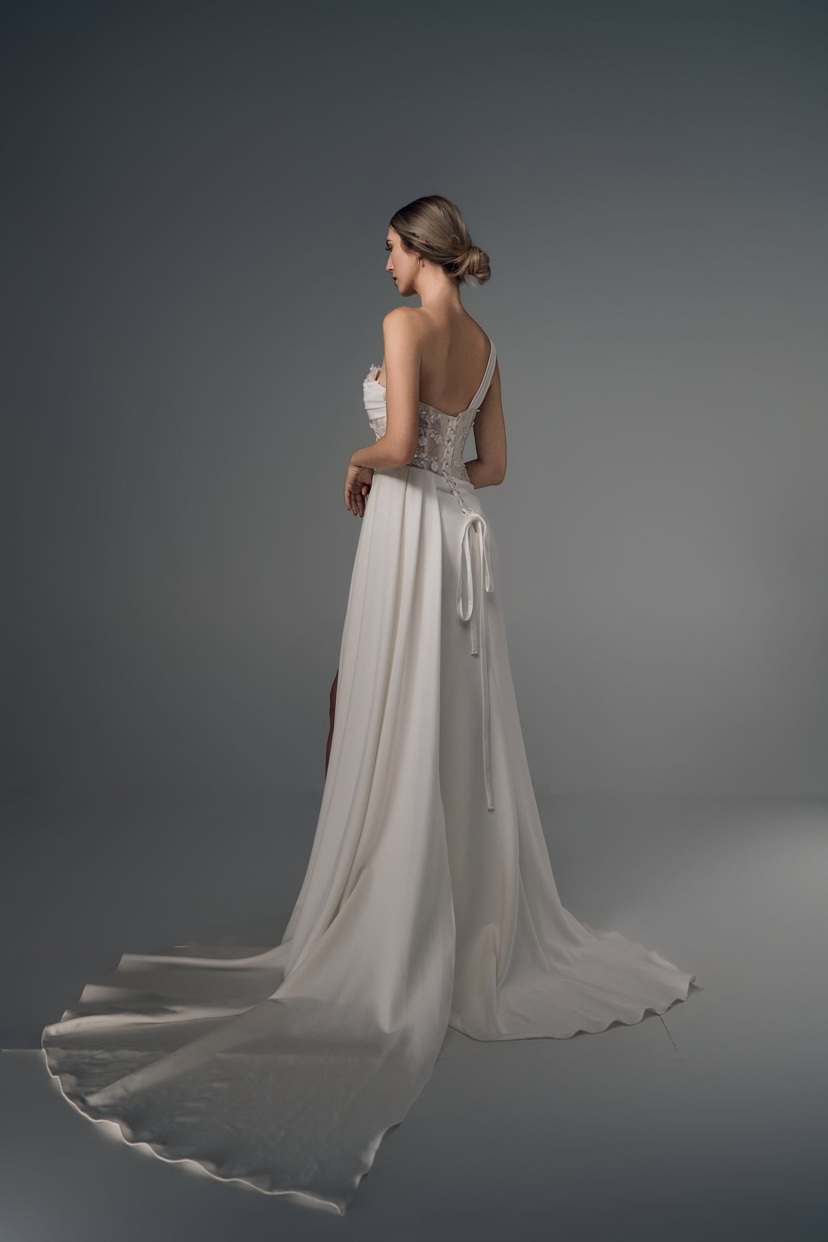 Leontine asymmetric satin wedding dress, side train view