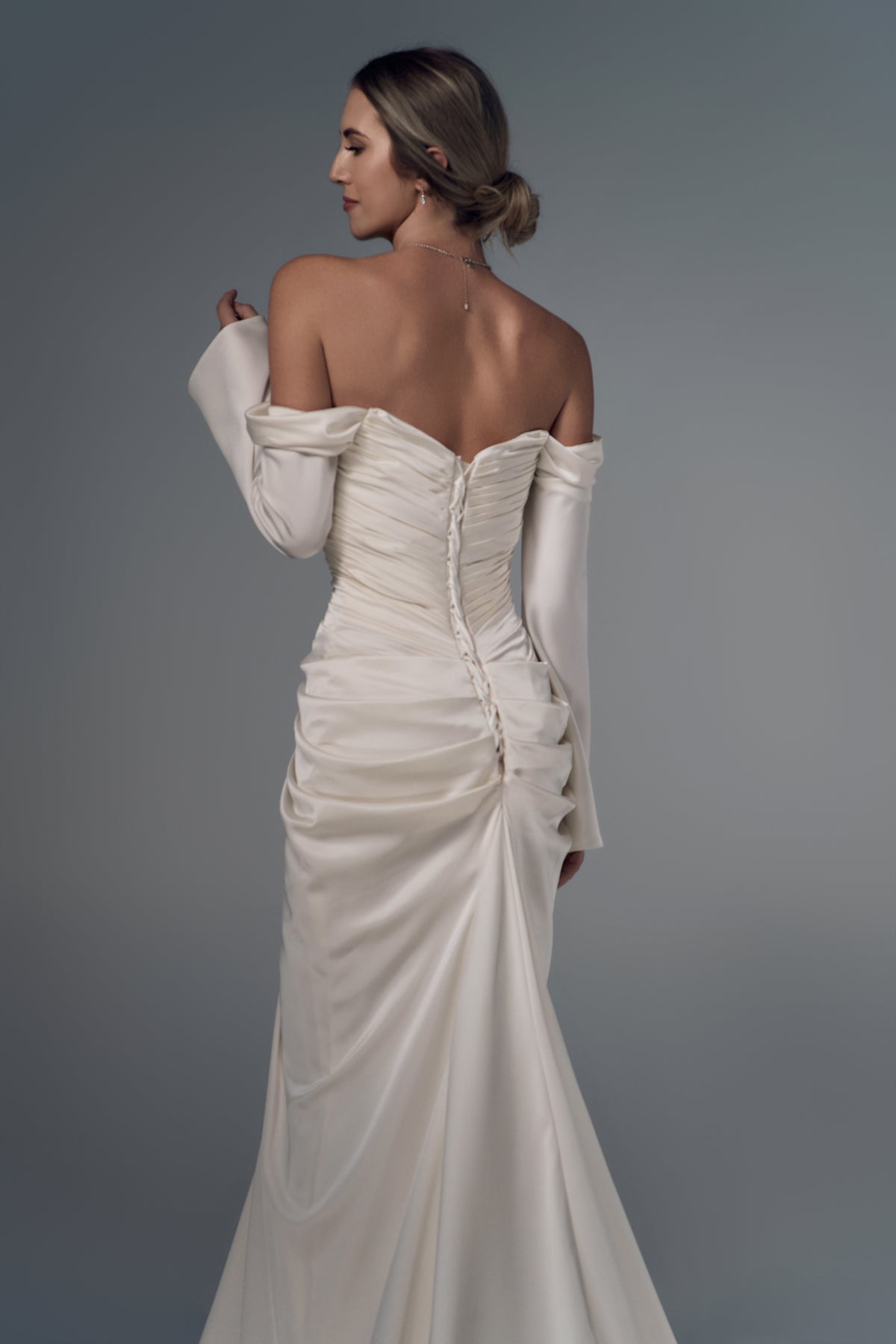 Lorelei off-shoulder ruched satin mermaid wedding dress, lace-up back view