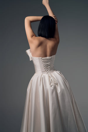 Lunara one-shoulder origami satin A-line wedding dress, lace-up back view