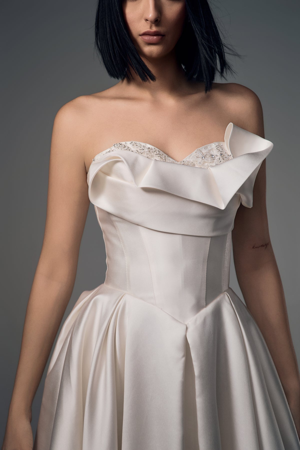 Lunara origami satin A-line wedding dress, folded bodice detail