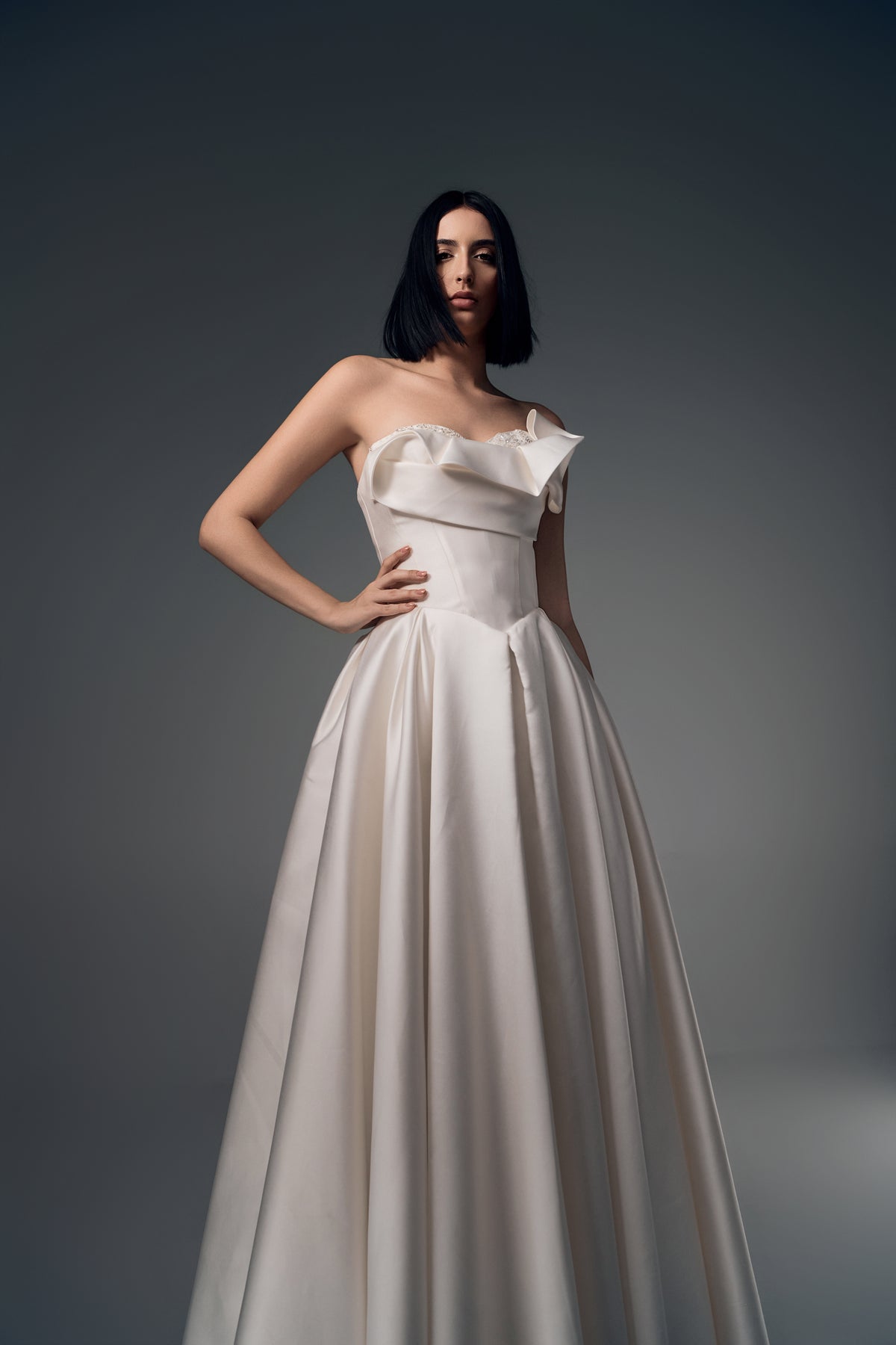 Lunara one-shoulder origami satin A-line wedding dress, skirt view