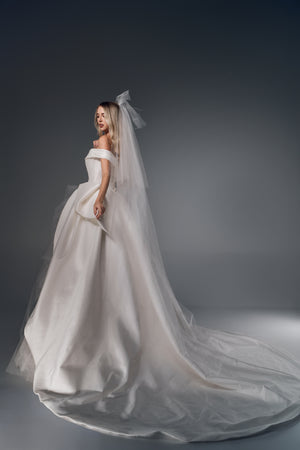 Marcelline asymmetric folded satin A-line wedding dress, side train view