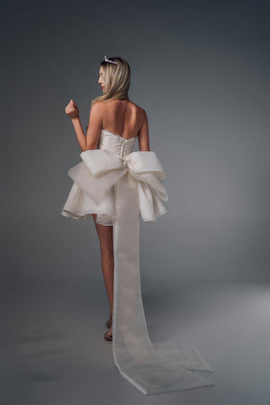 Phaenna strapless high-low wedding dress with bow train, back view
