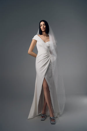 Reverie asymmetric draped wedding dress with front split, full-length front view