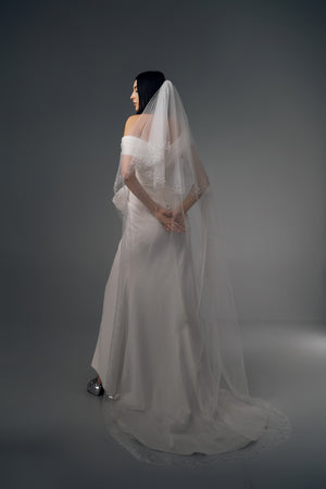 Reverie asymmetric draped wedding dress, veil styling view