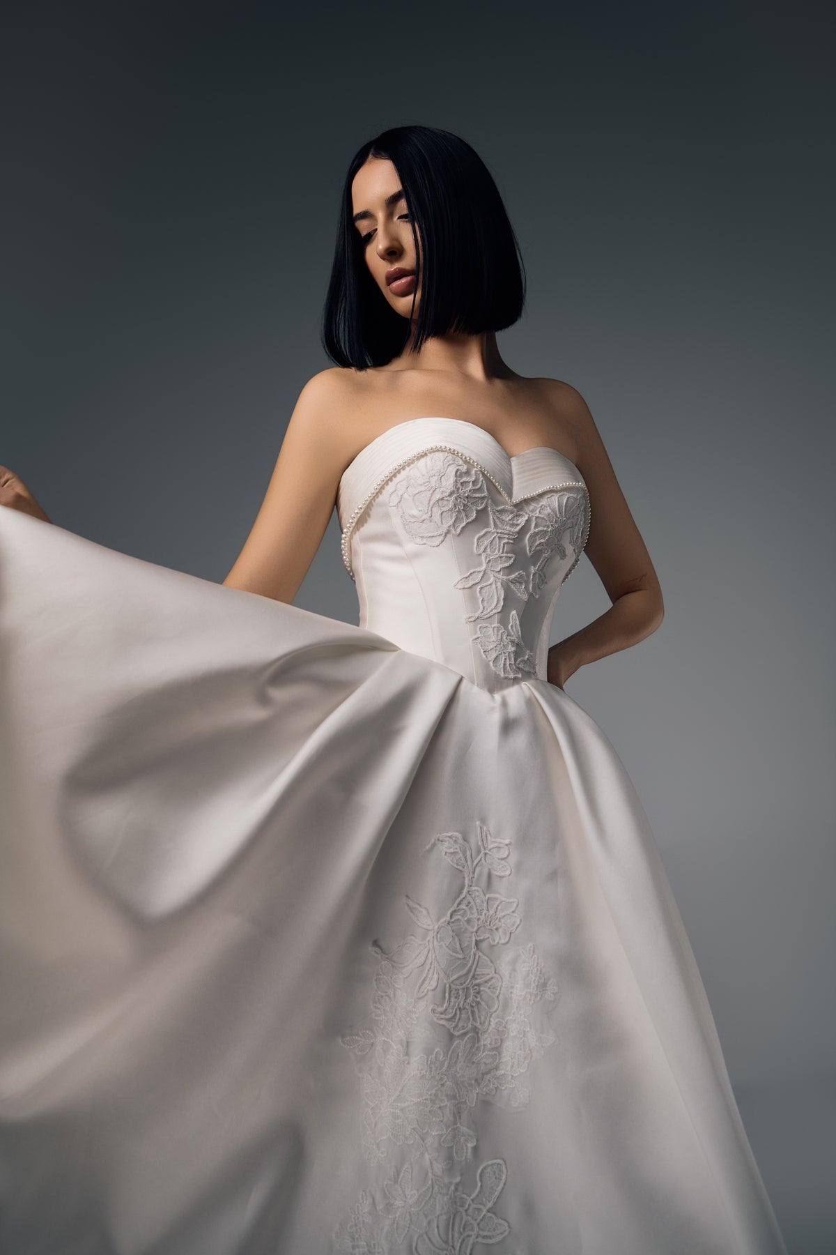 Thessalia strapless satin A-line wedding dress, flowing skirt view